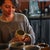 Woman admires custom mug in shop