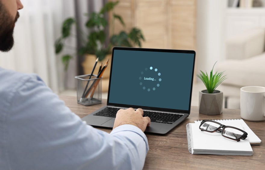 Laptop screen showing a loading icon