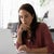 Woman focused as she works at a laptop