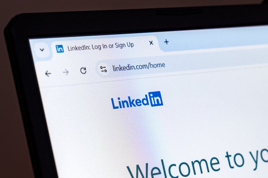Laptop screen showing the LinkedIn login page