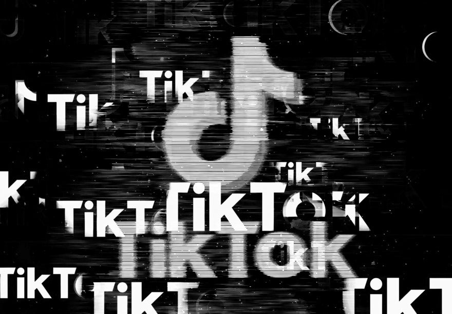 Fragmented TikTok logo against a black background