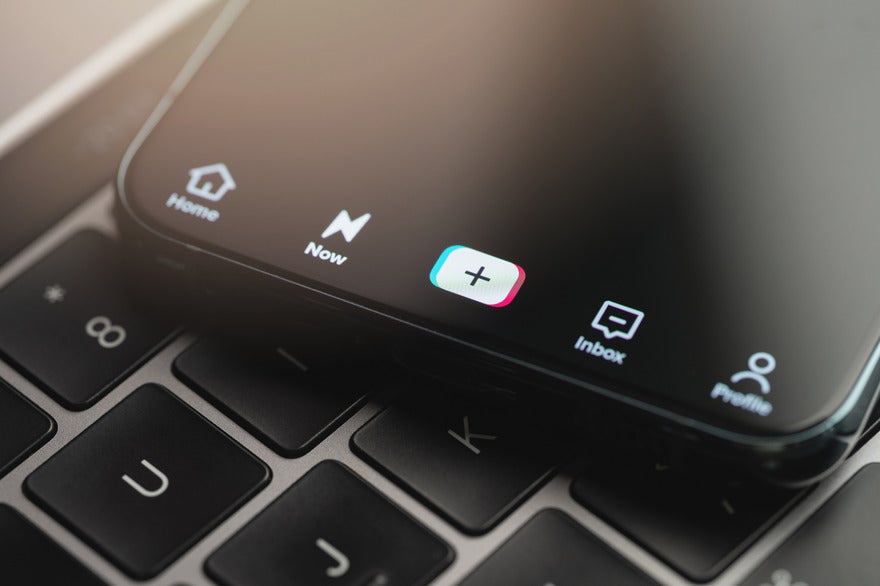 bottom of iphone screen on TikTok app, showing the home, create, inbox, and profile tabs