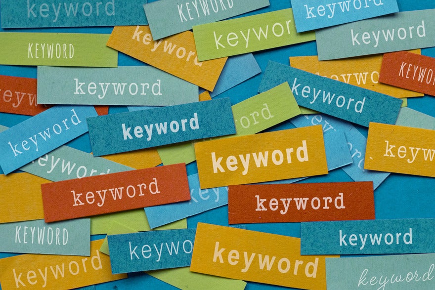 Snippets of colored paper with the word "keyword" written on them