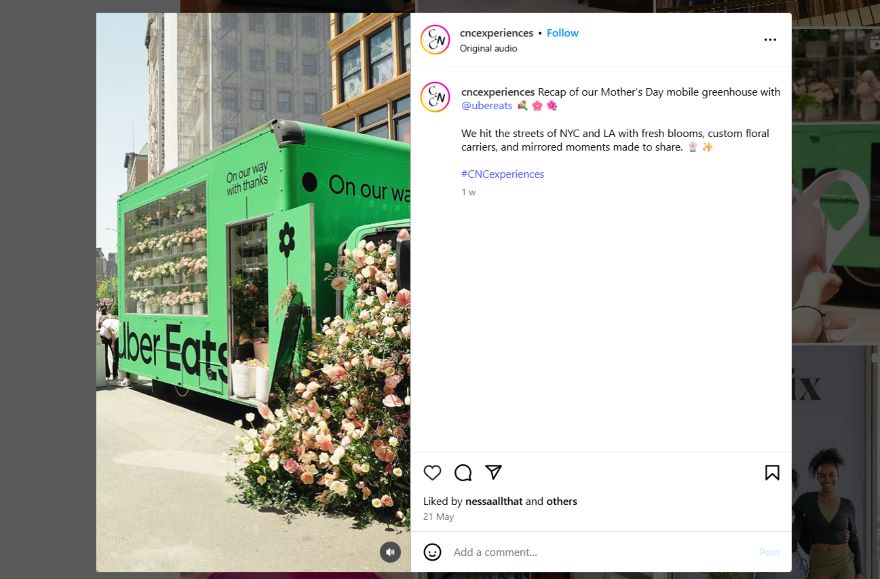 An Instagram post of a vibrant green mobile greenhouse adorned with fresh flowers and the Uber Eats logo, set against an urban backdrop.