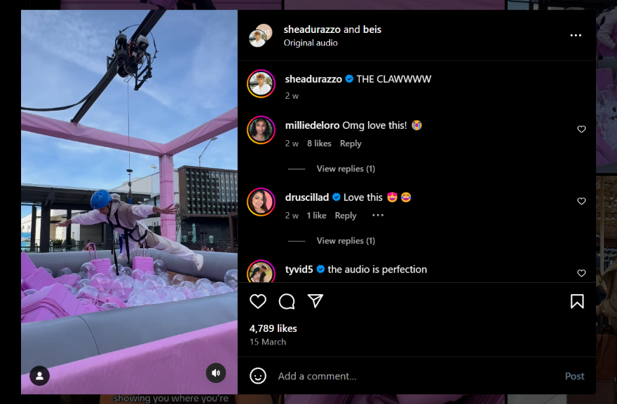 An Instagram post showing a person strapped into a human claw machine