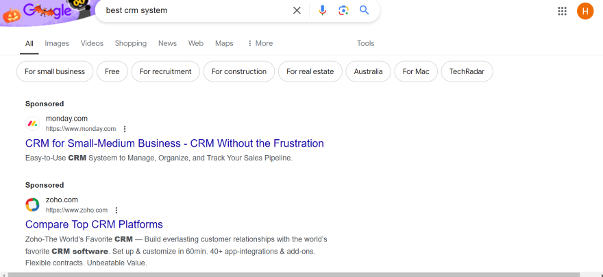 Screenshot of a Google results page for "best CRM system" and sponsored results at the top