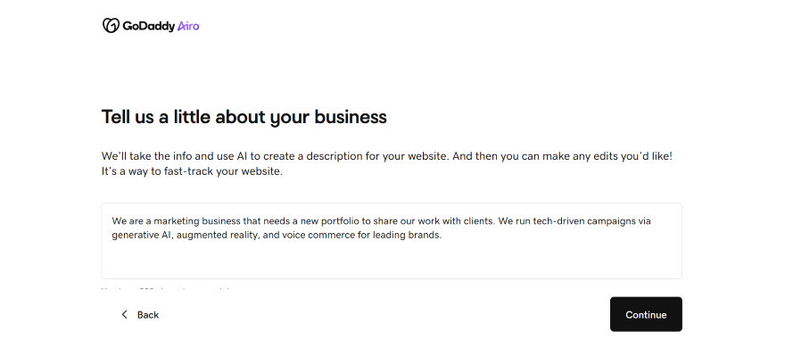 GoDaddy Airo interface prompting users to describe their business for AI-generated website content, with an example provided.