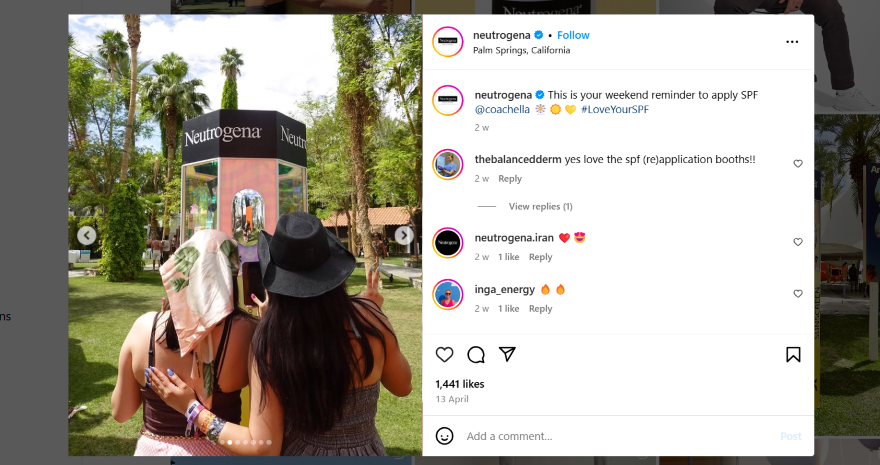 Influencers posing in front of a neutrogena stand at a festival