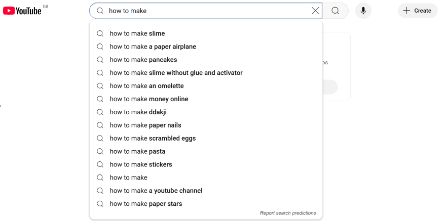 Screenshot of the YouTube search bar with the dropdown featuring related queries